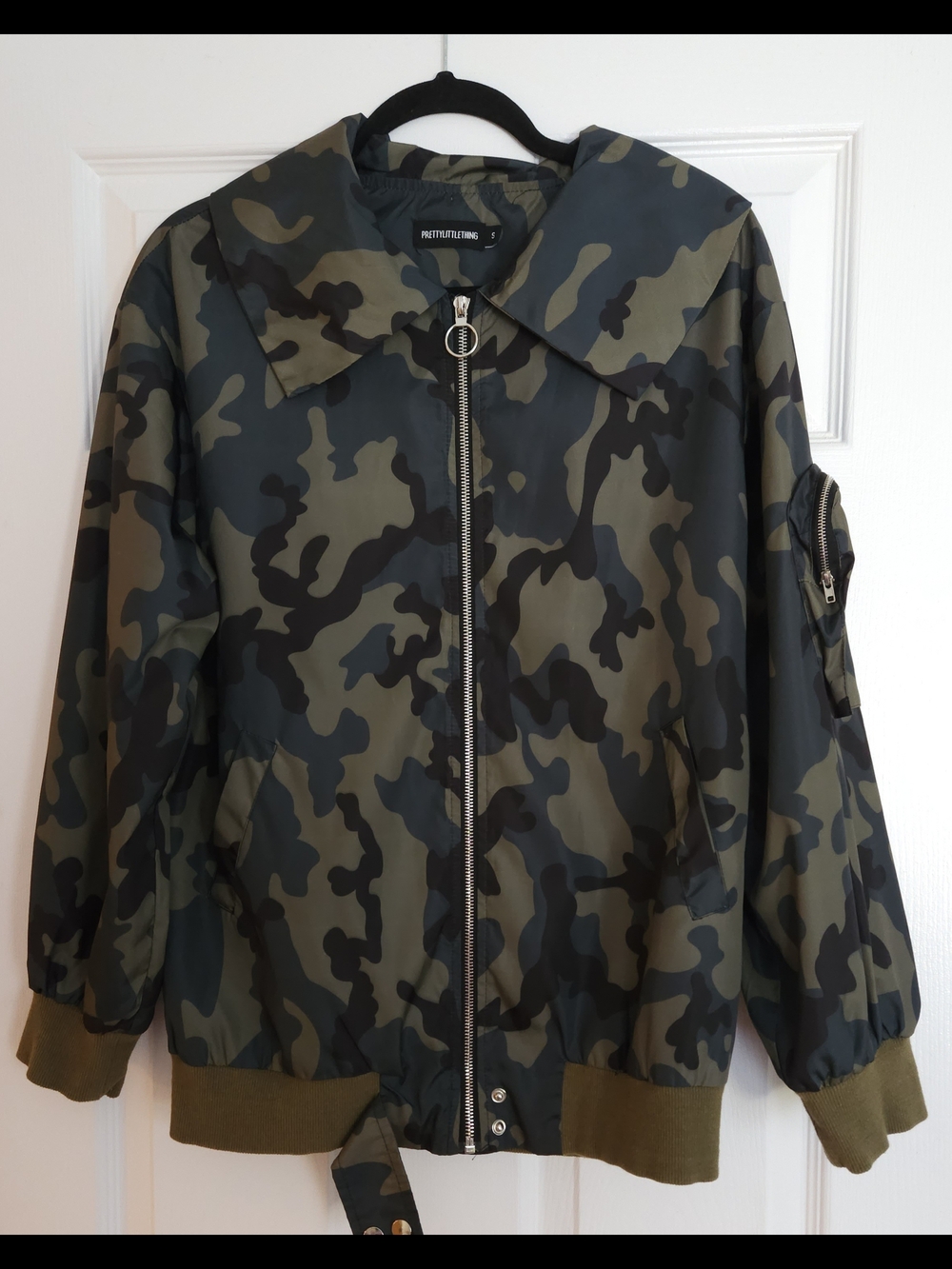 NWOT. PrettyLittleThing Olive and Black Camo Windbreaker  Jacket. Size S/M.